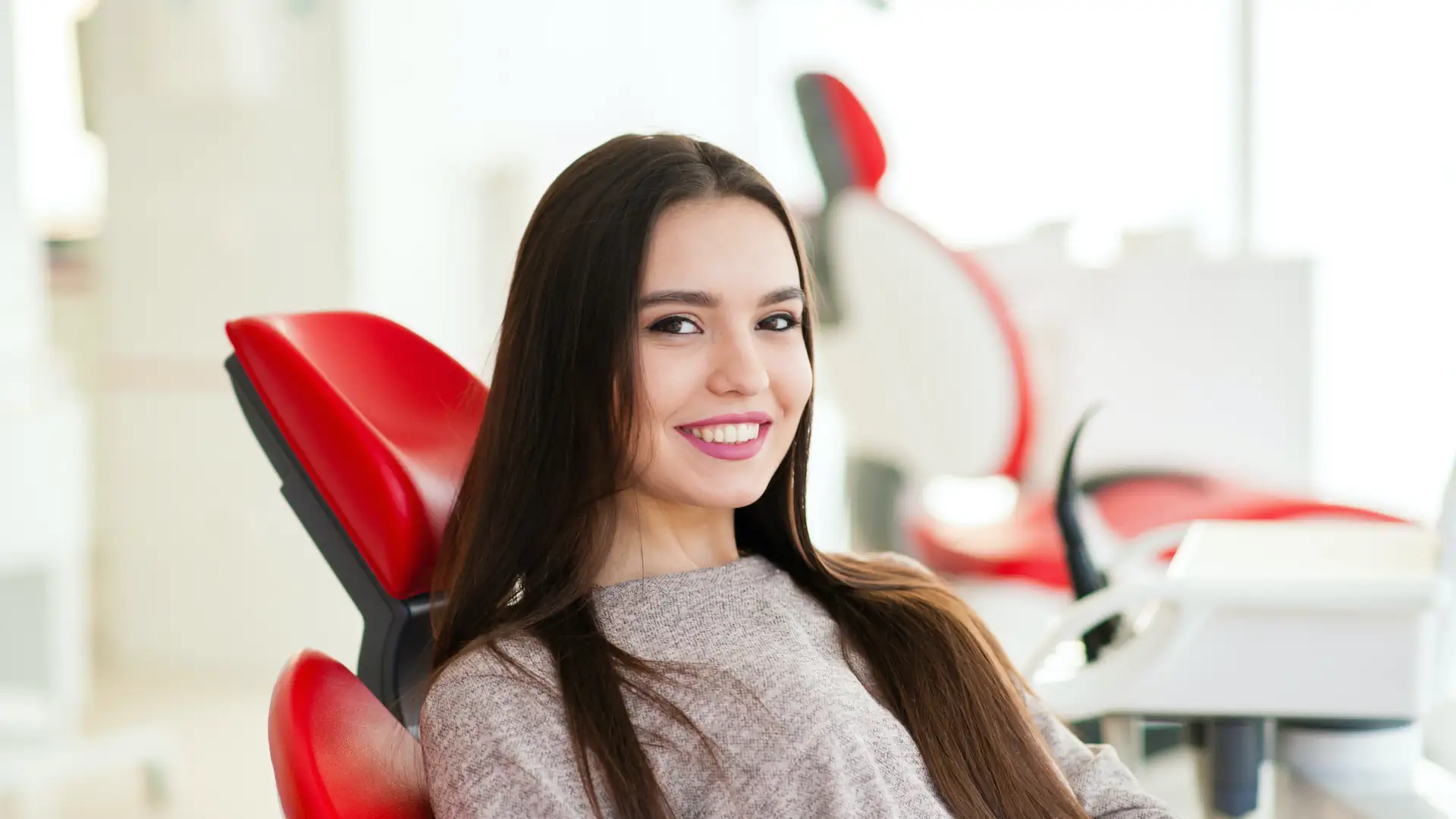 Smiling woman at dentist